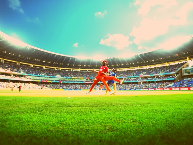 A television and smartphone displaying the India vs Australia live broadcast and a fantasy points overlay side by side